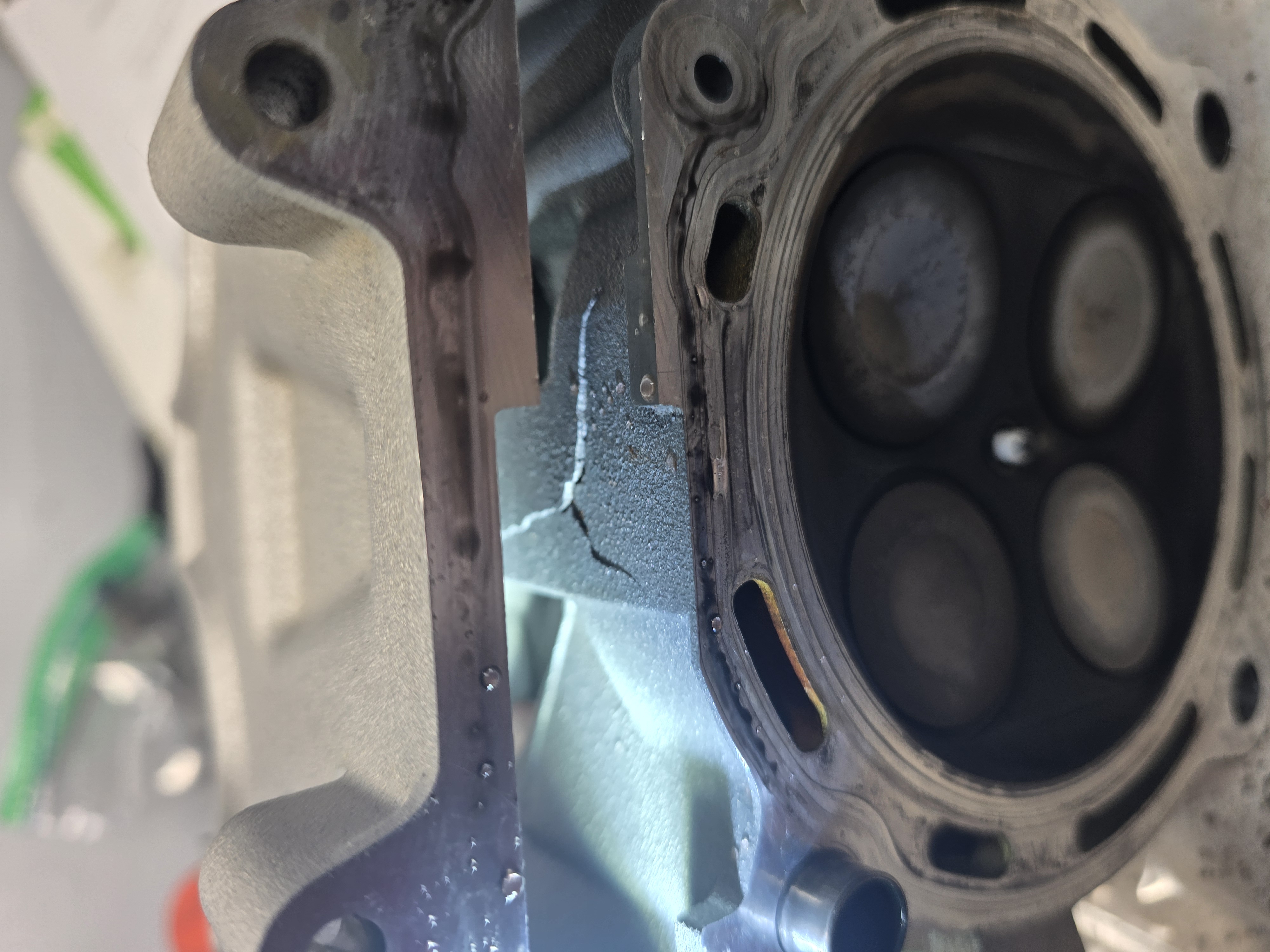 Cracked cylinder head on the KX450 - the damage from frozen coolant